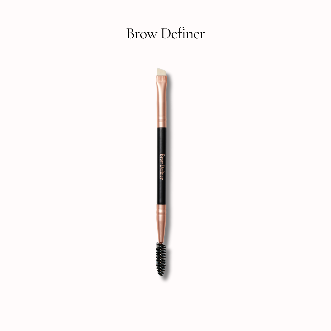 Brow definer brush with rose gold and black design on a white background