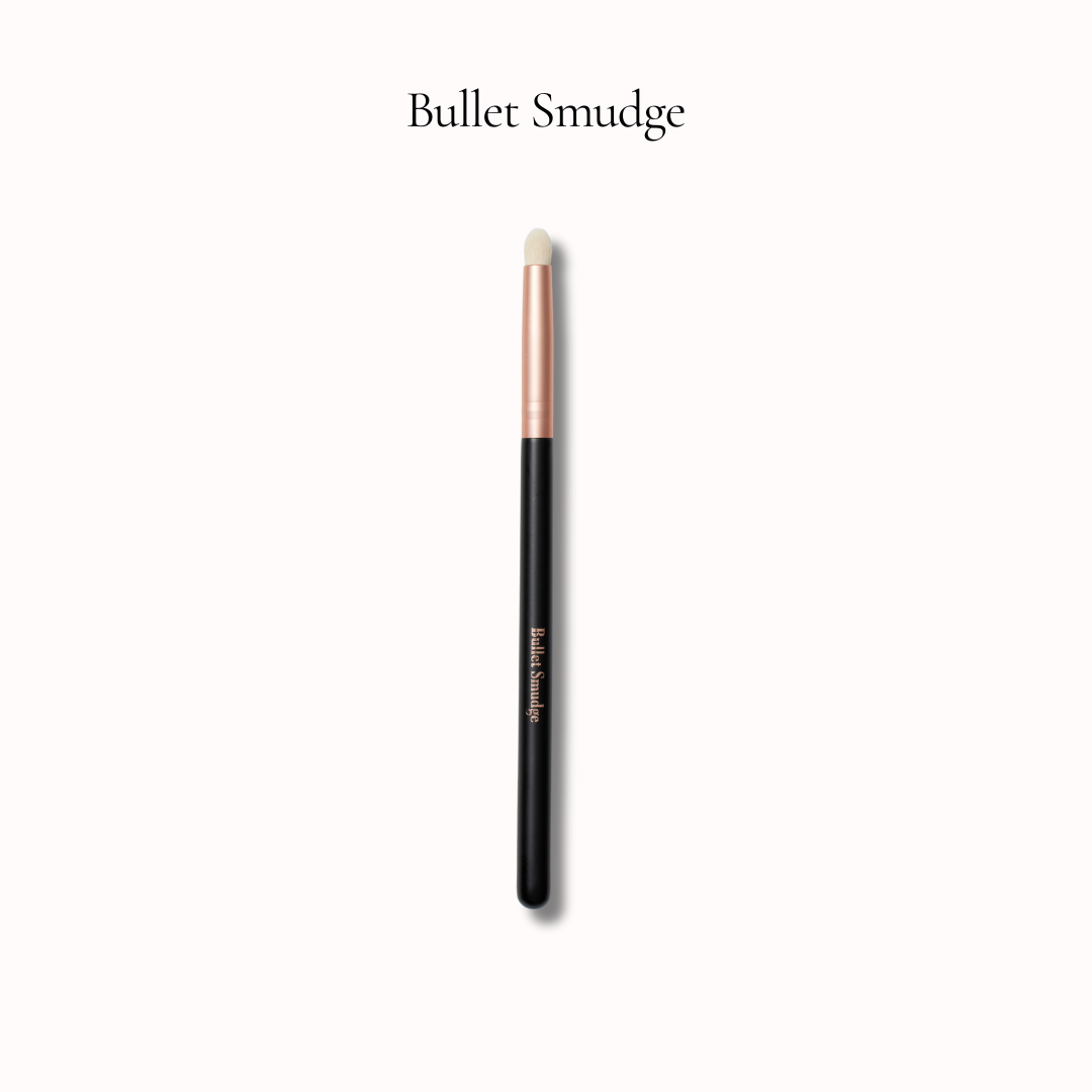 Makeup brush labeled 'Bullet Smudge' on a white background
