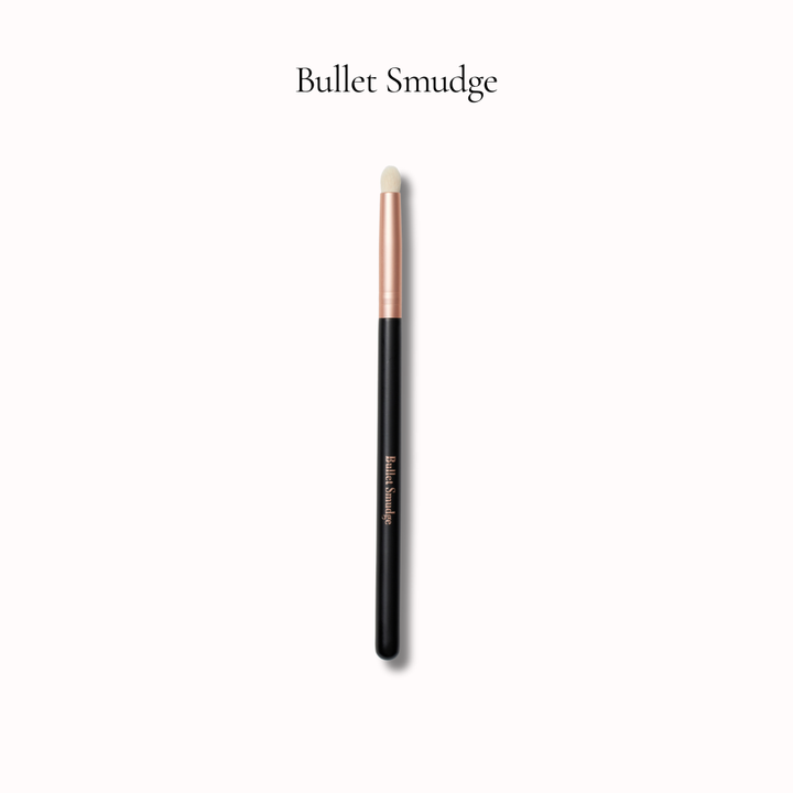 Makeup brush labeled 'Bullet Smudge' on a white background